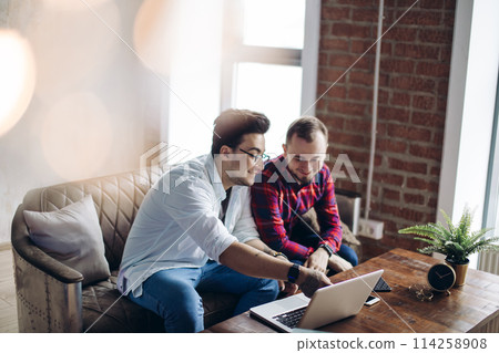 Homosexual partners working at office desk, relationships and business concept Homosexual partners working at office desk, relationships and business concept 114258908