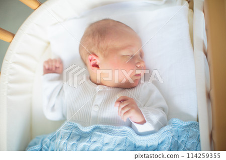 Newborn baby boy in hosptal cot Newborn baby boy in hosptal cot 114259355