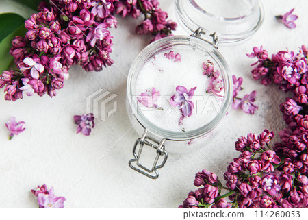 Lilac sugar in glass jar and fresh flowers 114260053