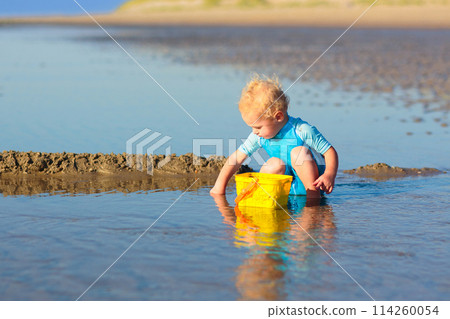 Kids playing on beach. Children play at sea. 114260054