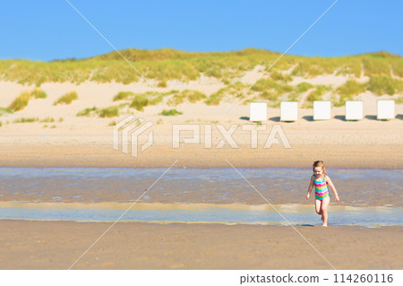 Kids playing on beach. Children play at sea. Kids playing on beach. Children play at sea. 114260116