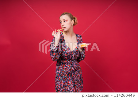 Unhealthy eating. Junk food concept. Portrait of fashionable young woman holding fried potato 114260449