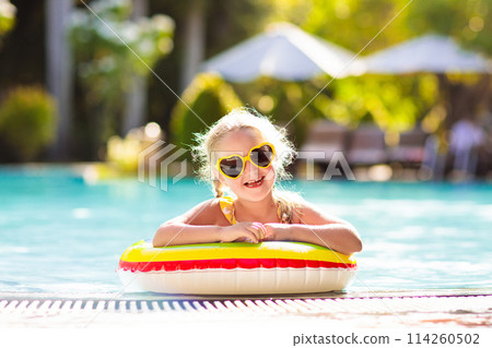 Child in swimming pool. Kids swim. Water play. 114260502