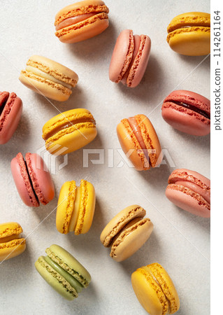 Colorful yellow, pink Macrons, top view, Sweet dessert, sugar Colorful yellow, pink Macrons, top view, Sweet dessert, sugar 114261164