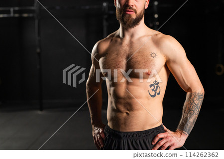 Portrait of handsome muscular man in gym. Routine workout for physical and mental health. Portrait of handsome muscular man in gym. Routine workout for physical and mental health. 114262362