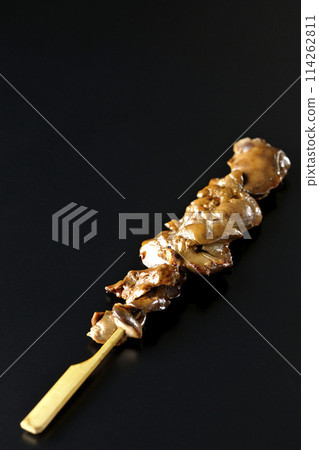 Yakitori and liver photographed against a black background 114262811