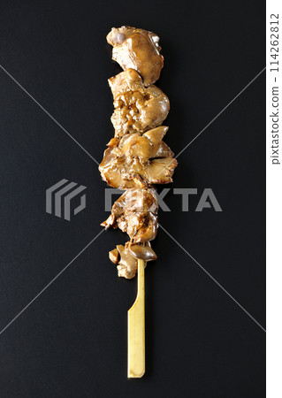 Yakitori and liver photographed against a black background 114262812