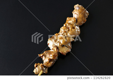Yakitori and liver photographed against a black background 114262820