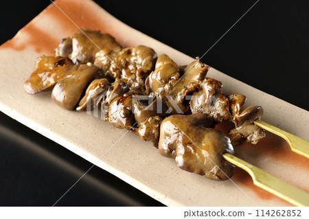 Yakitori and liver photographed against a black background 114262852