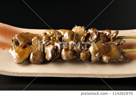 Yakitori and liver photographed against a black background 114262870