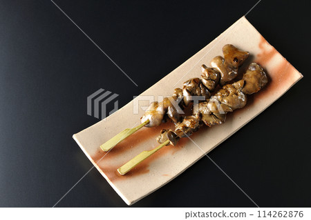 Yakitori and liver photographed against a black background 114262876