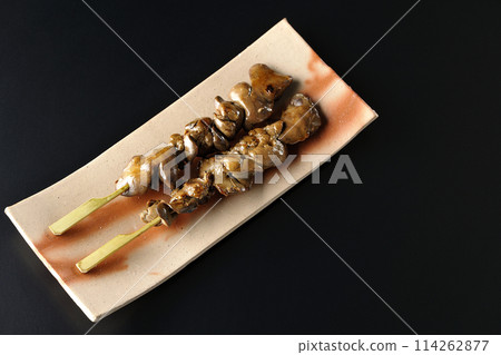 Yakitori and liver photographed against a black background 114262877