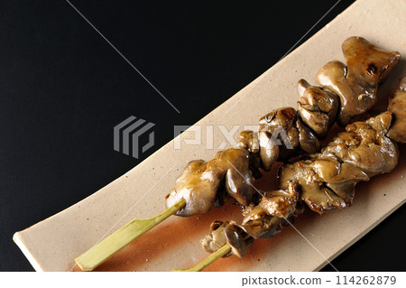 Yakitori and liver photographed against a black background 114262879