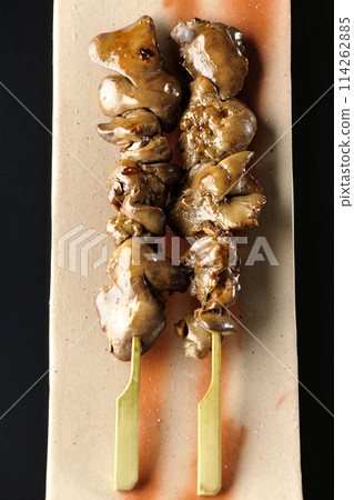 Yakitori and liver photographed against a black background 114262885