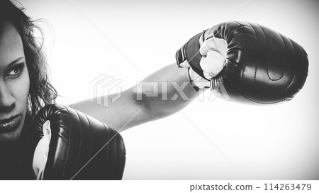 Boxer girl exercise with boxing gloves. 114263479