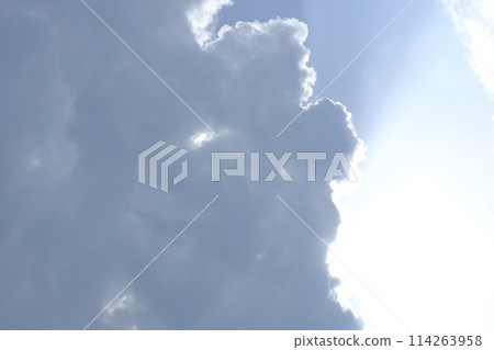 The sun hides behind the clouds 114263958