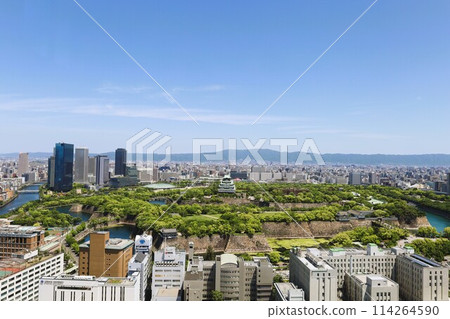 Golden Week, early May, young leaves, Osaka Castle Park in early summer, Osaka Castle with fresh greenery as seen from the lounge of a high-rise apartment Golden Week, early May, young leaves, Osaka Castle Park in early summer, Osaka Castle with fresh greenery as seen from the lounge of a high-rise apartment 114264590