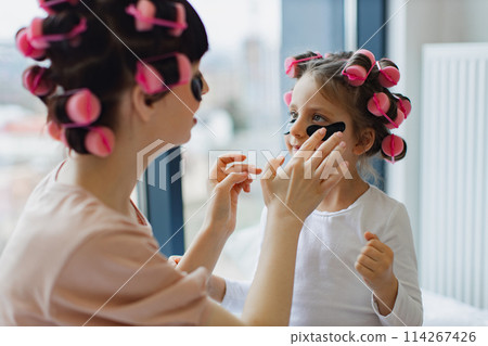 Caucasian family spends free time having cosmetic procedures. Caucasian family spends free time having cosmetic procedures. 114267426