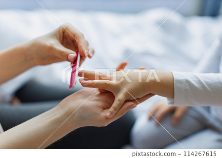 Close-up view of little girl's hand. Close-up view of little girl's hand. 114267615