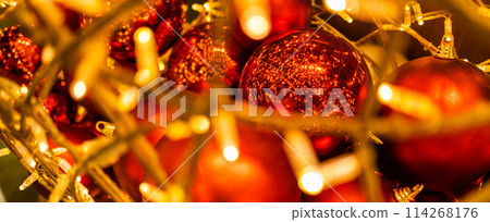 Banner close up of red Christmas balls baubles. Bokeh garlands. Xmas and holidays concept. Copy space and empty place for text, mock up greeting card 114268176
