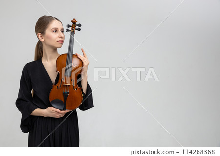 Woman professional violist playing musical instrument 114268368
