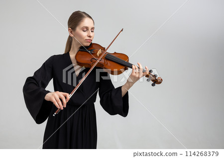 Woman professional violist playing musical instrument 114268379