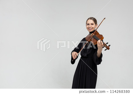 Woman musical artist playing violin 114268380