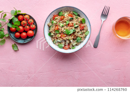 Quinoa tabbouleh salad in a bowl, a healthy dinner with tomatoes and mint 114268760