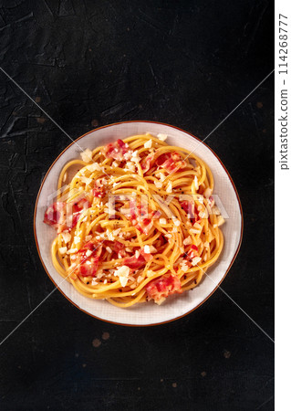 Carbonara pasta dish, traditional spaghetti with pancetta and cheese Carbonara pasta dish, traditional spaghetti with pancetta and cheese 114268777
