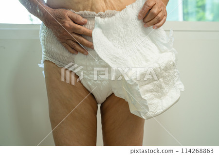 Asian senior woman patient wearing incontinence diaper in hospital, healthy strong medical. Asian senior woman patient wearing incontinence diaper in hospital, healthy strong medical. 114268863