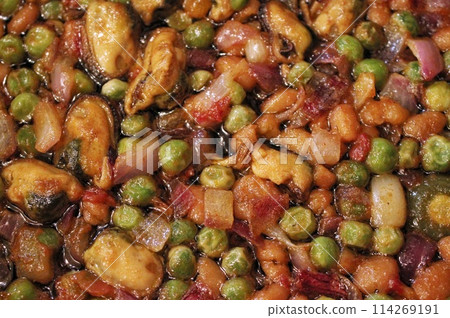 Stewed mussels with green pea and onion. Healthy homecooking. Pescetarian menu with vegetables. Balanced grocery food. Organic diet Stewed mussels with green pea and onion. Healthy homecooking. Pescetarian menu with vegetables. Balanced grocery food. Organic diet 114269191