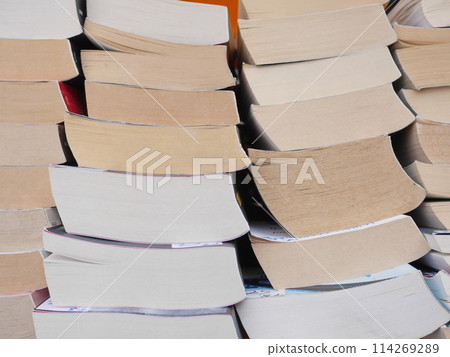 A stack of books with the top one being red 114269289
