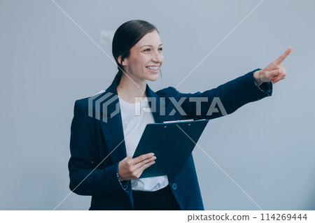 Young businesswoman hold with clipboard Young businesswoman hold with clipboard 114269444