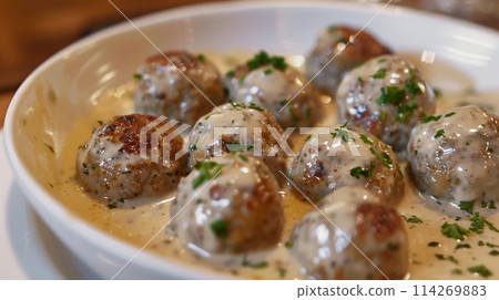 Swedish meatballs in cream sauce 114269883
