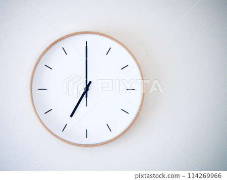Isolated on white background Minimalist style wooden wall clock, showing time at 7.00 or 19.00 Isolated on white background Minimalist style wooden wall clock, showing time at 7.00 or 19.00 114269966