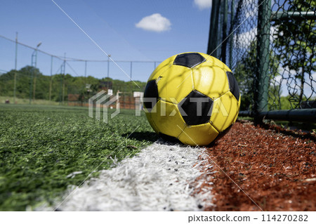 Close up on a football ball on the football field 114270282