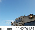 Windmills, blue sky and diesel trains at Oga Station 114270484