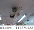 A nostalgic electric fan attached to a train 114270528