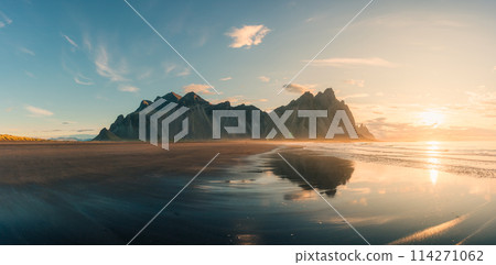 Golden sunrise on Vestrahorn mountain with black sand beach in summer at Stokksnes peninsula 114271062