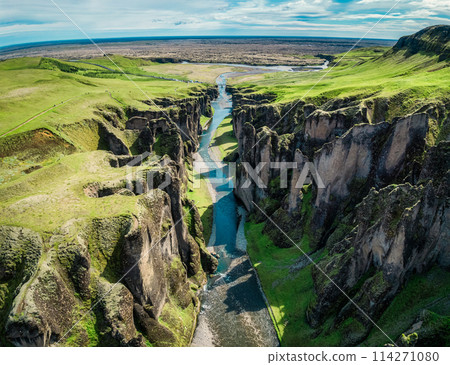 Fjadrargljufur rugged canyon naturally eroded with Fjadra river flowing in summer at Iceland 114271080