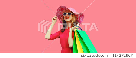 Beautiful happy smiling young woman model posing with shopping bags in summer hat Beautiful happy smiling young woman model posing with shopping bags in summer hat 114271967