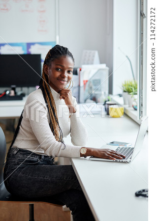 joyful afro leader of the company posing to the camera joyful afro leader of the company posing to the camera 114272172