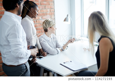 pleasant employees watching TV during the rest 114272193
