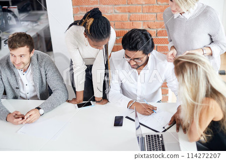 mixed arced team trying to achieve good results in business 114272207