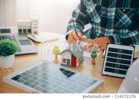 Wind energy engineer designing and developing project for residential district 114272276