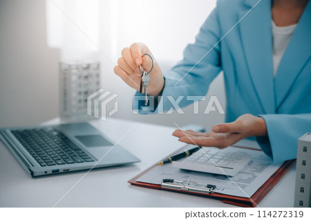 Real estate agent talked about the terms of the home purchase agreement and asked the customer to sign the documents to make the contract legally, Home sales and home insurance concept. 114272319