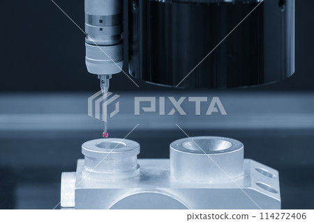 Closeup scene the multi-axis CMM machine measuring the aluminum automotive parts. Closeup scene the multi-axis CMM machine measuring the aluminum automotive parts. 114272406
