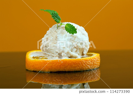 photo of cutted orange with ice cream . 114273390