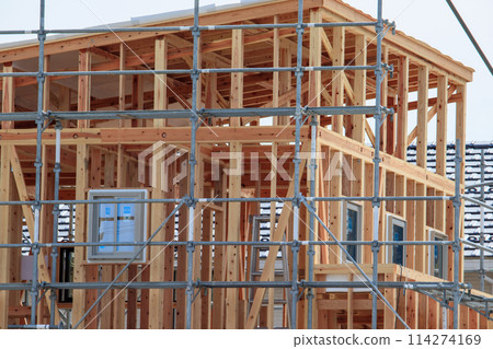 Construction work underway on a wooden house Construction work underway on a wooden house 114274169