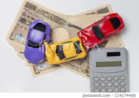 A miniature car whose body was deformed in an accident and some money 114274488